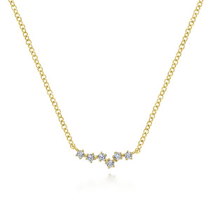 Gabriel & Co. NK6118Y45JJ 14 karat yellow gold Lusso necklace, front view of the staggered line of separate prong set diamonds dipping at the center