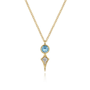 Gabriel & Co. NK6122Y45BT 14 karat yellow gold Color necklace, front view of a bezel set blue round stone above a kite shaped drop with a diamond