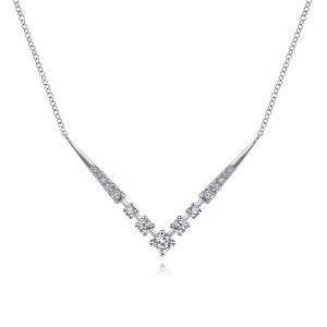 Gabriel & Co. NK6188W45JJ 14 karat white gold Kaslique necklace, front view of the V shaped bar with tapered pave spikes and graduated prong stones