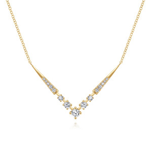 Gabriel & Co. NK6188Y45JJ 14 karat yellow gold Kaslique necklace, front view of the chevron bar with tapered spikes and graduated prong set diamonds