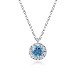 Gabriel & Co. NK6341W45BT 14 karat white gold Color necklace, front view of the blue round stone, its three prongs and the ring of tiny diamonds