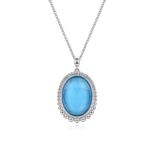 Gabriel & Co. NK6540SVJXT sterling silver Bujukan necklace, front view of the faceted blue oval stone and its graduated bead rim