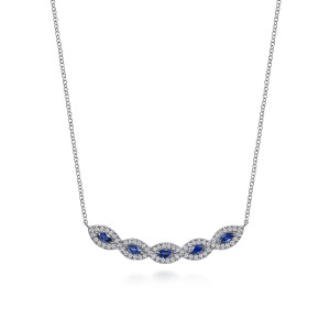 Gabriel & Co. NK6628W45SA 14 karat white gold Color necklace, front view of the curved bar of blue marquise stones in overlapping diamond frames