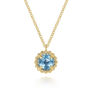 Gabriel & Co. NK6745Y4JBT 14 karat yellow gold Color necklace, front view of the blue stone, its four prongs and the scalloped bead rim below a plain loop