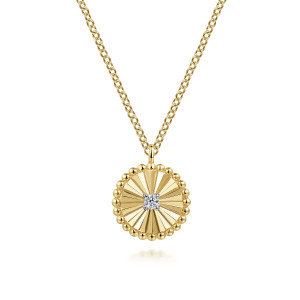 Gabriel & Co. NK6862M45JJ 14 karat white and yellow gold Bujukan necklace, front view of the ridged disc, its lone round diamond and the beaded rim