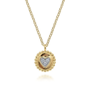 Gabriel & Co. NK6863Y45JJ 14 karat yellow gold Bujukan necklace, front view of the polished disc, its beaded rim and the diamond heart