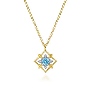 Gabriel & Co. NK6873Y45BT 14 karat yellow gold Color necklace, front view of the four lobed frame with its light blue stone and corner spikes