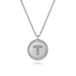 Gabriel & Co. NK6919T-SV5JJ sterling silver Bujukan necklace, front view of the round disc with the letter T in small stones and a beaded rim