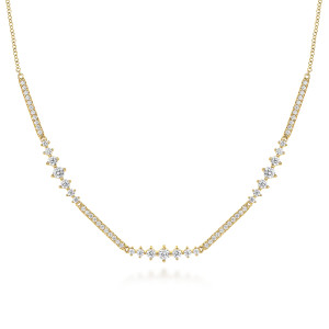 Gabriel & Co. NK6954Y45JJ 14 karat yellow gold Lusso necklace, close detail of the curved bar, pave sections between graduated prong set stones