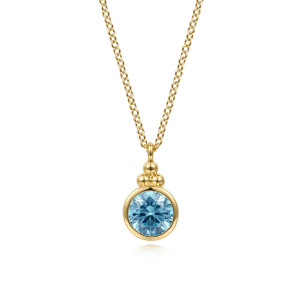 Gabriel & Co. NK7053Y4JBT 14 karat yellow gold Bujukan necklace, front view of the bezel set blue stone under its beads and bail