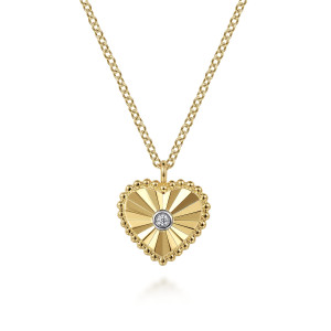 Gabriel & Co. NK7063M45JJ 14 karat white and yellow gold Bujukan necklace, front view of the fluted heart face, its bezel set diamond and beaded rim