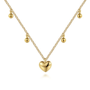 Gabriel & Co. NK7064Y4JJJ 14 karat yellow gold Bujukan necklace, front view of the puffed heart with round metal bead drops on either side
