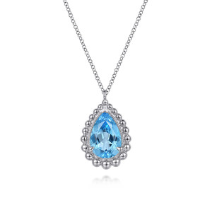 Gabriel & Co. NK7096SVJBT sterling silver Bujukan necklace, front view of the blue pear shaped stone, its end prongs and the metal bead rim