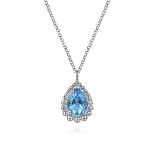Gabriel & Co. NK7097SVJBT sterling silver Bujukan necklace, front view of the pear shaped blue stone inside its beaded teardrop frame and bail