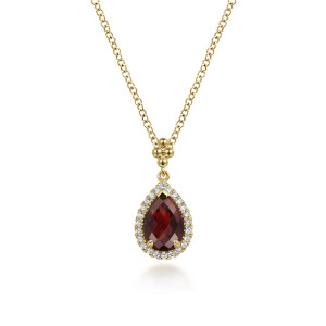 Gabriel & Co. NK7393Y45GN 14 karat yellow gold Bujukan necklace, front view of the red pear stone, prongs and diamond halo beneath the metal bead cluster