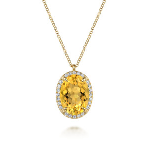 Gabriel & Co. NK7459Y45CT 14 karat yellow gold Color necklace, front view of the yellow oval stone in claw prongs inside a halo of round diamonds