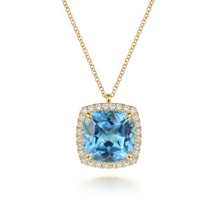 Gabriel & Co. NK7463Y45BT 14 karat yellow gold Color necklace, front view of the cushion shaped blue stone, corner prongs and diamond halo