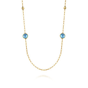 Gabriel & Co. NK7465-32Y4JBT 14 karat yellow gold Bujukan necklace, close detail of two bezel set blue stones and polished metal beads on paperclip links