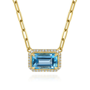 Gabriel & Co. NK7468Y45BT 14 karat yellow gold Color necklace, front view of the blue stone, its corner prongs and the border of small diamonds