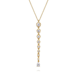 Gabriel & Co. NK7615Y84JJ 18 karat yellow gold Lusso necklace, front view of a graduated line of round stones ending in a pear shaped stone