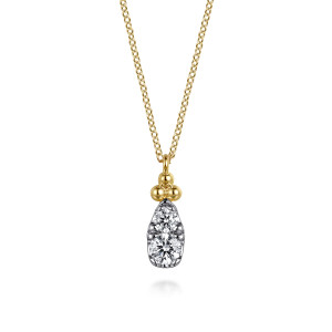 Gabriel & Co. NK7748Y45JJ 14 karat yellow gold Bujukan necklace, front view of the metal bead cluster above the stacked pair of round stones