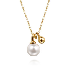 Gabriel & Co. NK7789Y4JPL 14 karat yellow gold Bujukan necklace, front view of a round pearl under a flared collar beside a polished metal bead