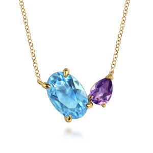 Gabriel & Co. NK7858Y4JMC 14 karat yellow gold Color necklace, front view of the tilted oval blue stone beside the purple pear stone, each held by pointed prongs