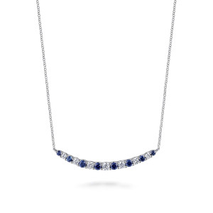 Gabriel & Co. NK7865W45SA 14 karat white gold Color necklace, front view of the curved bar with blue and colorless stones alternating
