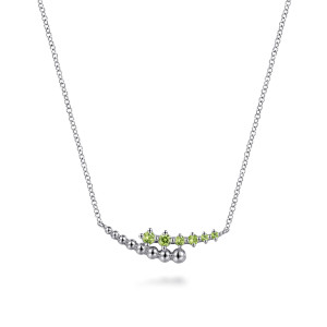 Gabriel & Co. NK7906SVJPE sterling silver Bujukan necklace, front view of the curved bypass bar, its graduated beads and light green stones