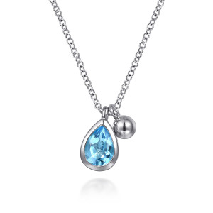 Gabriel & Co. NK7929SVJBT sterling silver Bujukan necklace, front view of the bezel set blue pear stone hanging beside the polished metal ball