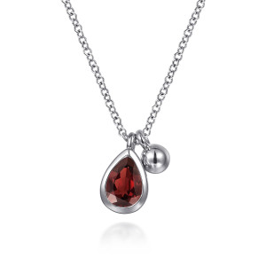 Gabriel & Co. NK7929SVJGN sterling silver Bujukan necklace, front view of the bezel set red pear stone hanging beside the round polished bead