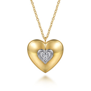 Gabriel & Co. NK8023-24M45JJ 14 karat white and yellow gold Contemporary necklace, front view of the domed heart with its inset heart of three prong set stones