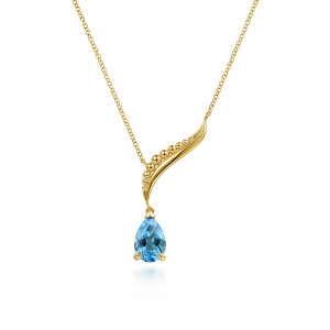 Gabriel & Co. NK8270Y4JBT 14 karat yellow gold Bujukan necklace, front view of the swept beaded curve and the blue pear stone set in prongs