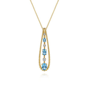 Gabriel & Co. NK8344Y45BT 14 karat yellow gold Bujukan necklace, front view of a beaded teardrop frame around blue oval stones and round colorless stones
