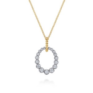 Gabriel & Co. NK8364M45JJ 14 karat white and yellow gold Bujukan necklace, front view of the open oval of graduated stones below its beaded bail
