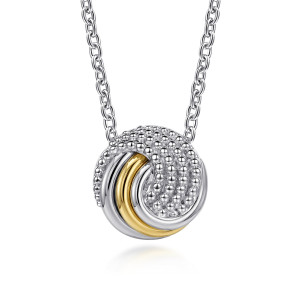 Gabriel & Co. NK8403-20MZJJJ sterling silver and 14 karat yellow gold Bujukan necklace, front view of the swirled disc, its metal bead field, ridged bands and warmer toned band