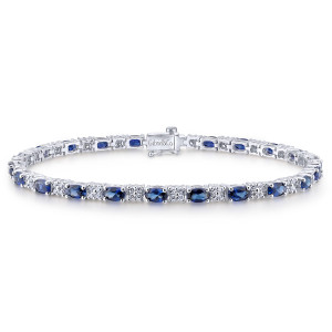 Gabriel & Co. TB1037W45SA 14 karat white gold Color bracelet, front view of blue ovals between round diamond clusters, closed by a box clasp with a maker's mark