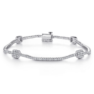 Gabriel & Co. TB3897W45JJ 14 karat white gold Lusso bracelet, front view of the diamond line with cushion shaped pave stations and a box clasp at the top