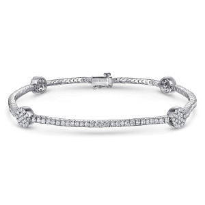 Gabriel & Co. TB3899W45JJ 14 karat white gold Lusso bracelet, front view of a tennis line with pave discs and a box clasp showing a latch