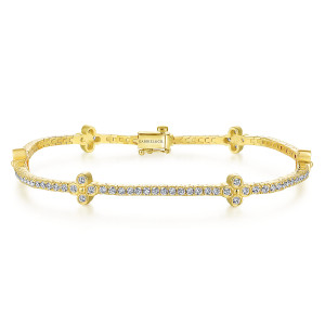 Gabriel & Co. TB4007Y45JJ 14 karat yellow gold Lusso bracelet, front view of a tennis line with clover stations and a box clasp showing its safety latch