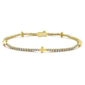 Gabriel & Co. TB4066Y45JJ 14 karat yellow gold Contemporary bracelet, front view of a tennis line of prong set diamonds with brushed crosses and a box clasp