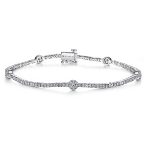 Gabriel & Co. TB4228W45JJ 14 karat white gold Lusso bracelet, front view of the fine tennis line with a round cluster station and a box clasp