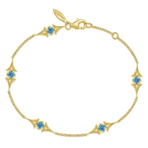 Gabriel & Co. TB4357Y4JBT 14 karat yellow gold Victorian bracelet, front view of a loop of fine chain with winged blue stone stations and a lobster clasp