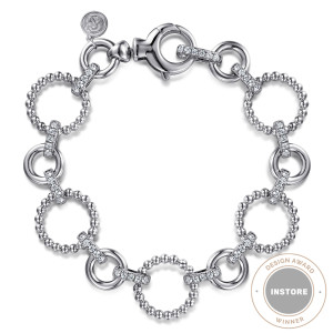 Gabriel & Co. TB4683-75SVJWS sterling silver Bujukan bracelet, front view of alternating beaded and smooth rings with a lobster clasp and a maker's tag