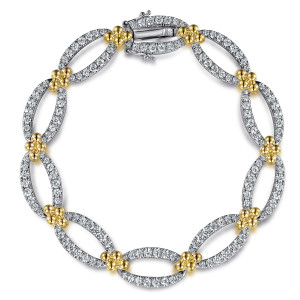 Gabriel & Co. TB4849M45JJ 14 karat white and yellow gold Bujukan bracelet, front view of open pave ovals joined by bead clusters, with a diamond set box clasp