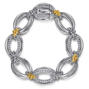 Gabriel & Co. TB5047MZJWS sterling silver and 14 karat yellow gold Bujukan bracelet, front view of the ring of ovals with a clasp inside a stone lined link