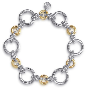 Gabriel & Co. TB5066-75MZJJJ sterling silver and 14 karat yellow gold Bujukan bracelet, front view of open circles and round rings joined by bead clusters, with a maker's tag