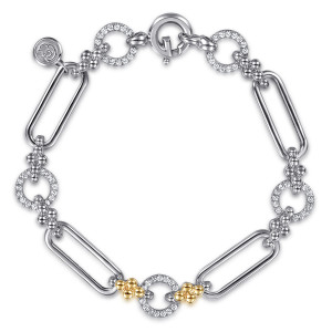 Gabriel & Co. TB5257-7MZJWS sterling silver and 14 karat yellow gold Bujukan bracelet, front view of elongated links, pave rings and bead clusters with a round clasp and maker's tag