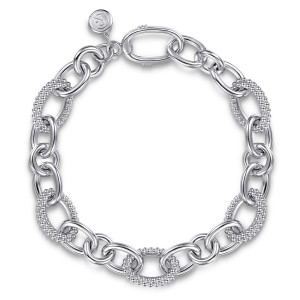 Gabriel & Co. TB5374-75SVJJJ sterling silver Bujukan bracelet, front view of glossy oval links with beaded ovals and a maker's tag beside the closure