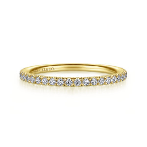 Gabriel & Co. WB14719C4Y44JJ 14 karat yellow gold Contemporary wedding band, front view of the evenly rounded hoop with round diamonds gripped by tiny prongs